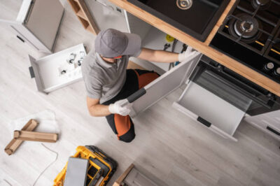 Professional Kitchen Cabinetmaker Installing Furniture Inside a Apartment